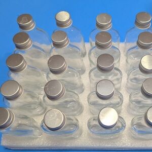 Set of Clear Glass Bottles with Silver Caps